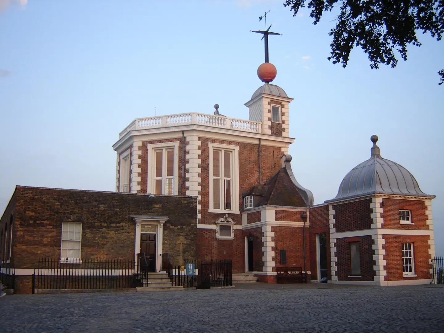The red brick Flamsteed House, with weathervane.